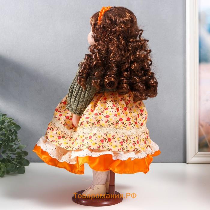 Кукла коллекционная керамика "Вера в платье с мелкими цветами и зелёном джемпере" 40 см